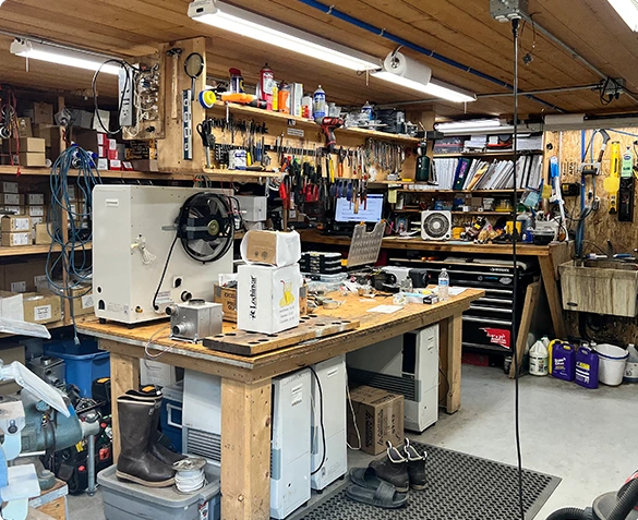 A workshop filled with heater repair tools and equipment.